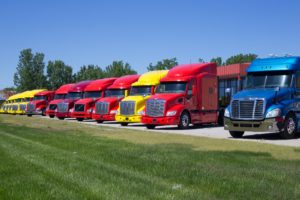 semi-tractor trailer trucks in parking lot