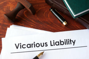 Papers with title Vicarious Liability on a table.